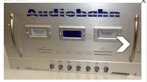 Audiobahn A5000SPL SPL Competition Amplifier - Silver aluminum chassis with dual analog meters, multiple control knobs, and handles - Amplifier with RCA inputs and speaker terminals.
